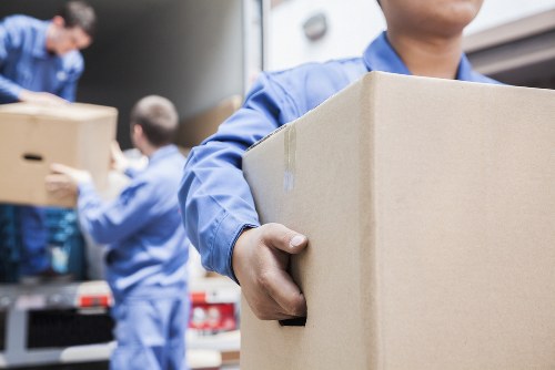 Moving team handling household items during a removals service