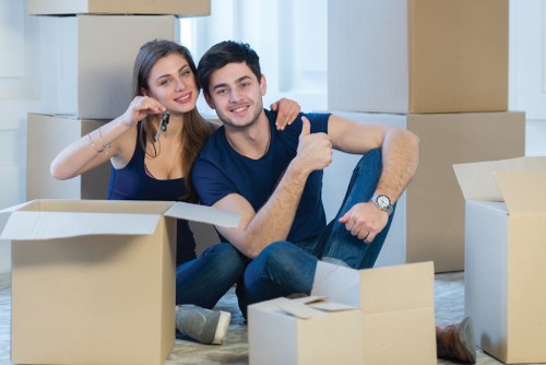 Insured removals staff handling furniture carefully