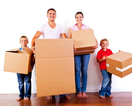 Moving team packing household items for a Brompton home relocation