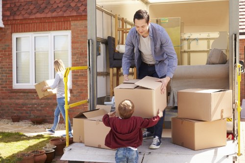 Removal crew loading furniture into a vehicle