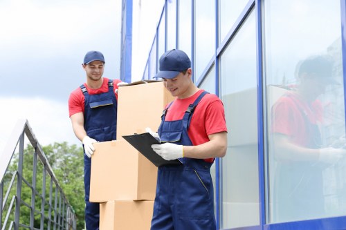 Trained movers using PPE during a safe relocation