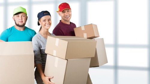 Packed moving boxes and furniture ready for removals in Brompton