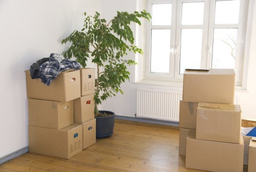 Movers carrying furniture during same day removals in Brompton