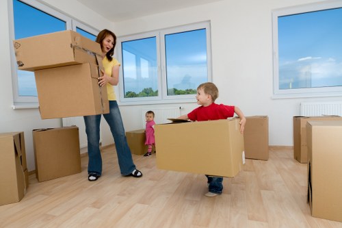 Unpacking boxes in a newly moved-in Brompton apartment