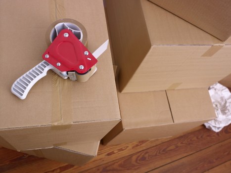Organized storage unit with boxes and furniture in Brompton