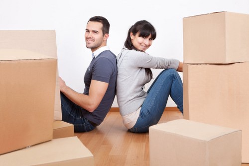 Packed household boxes ready for home moves in Brompton
